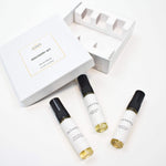 Olyantis's white box labeled Discovery Set containing three 5 ml glass bottles, arranged on a clean white background. The box is opened, showing the 3 perfume samples. 