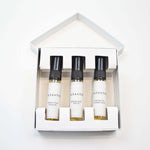 Olyantis's Discovery set  containing three 5 ml sample bottles with black caps and white labels, arranged inside a white square-shaped box on a clean white background.