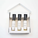 Olyantis's Discovery set  containing three 5 ml sample bottles with black caps and white labels, arranged inside a white square-shaped box on a clean white background.