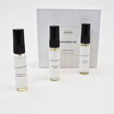 Olyantis's Discovery Set of 3x 5 ml perfume glass bottles, spaced, standing up in front of its white box. 