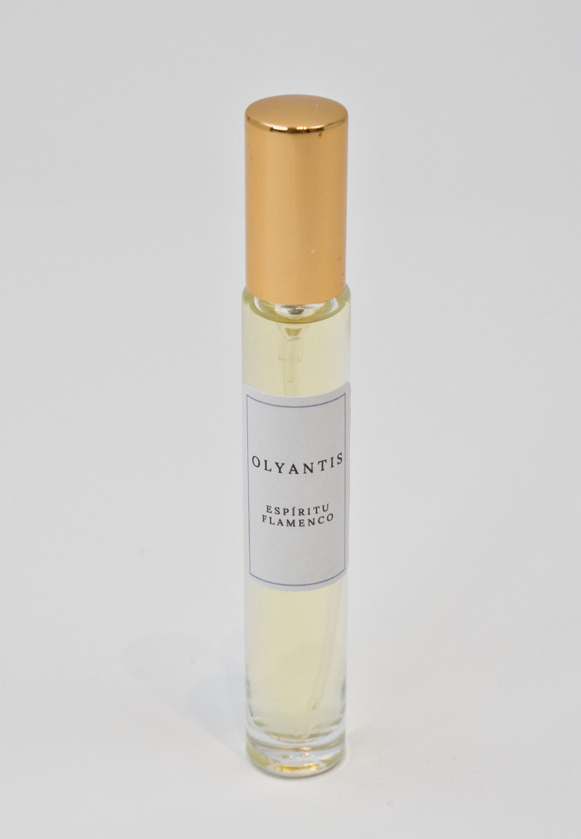 Olyantis's Espíritu Flamenco 10 ml perfume glass bottle with gold cap on a white background.
