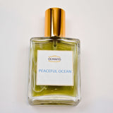 Olyantis 60 ml Peaceful Ocean eau de parfum bottle, lying flat on a white background. 
