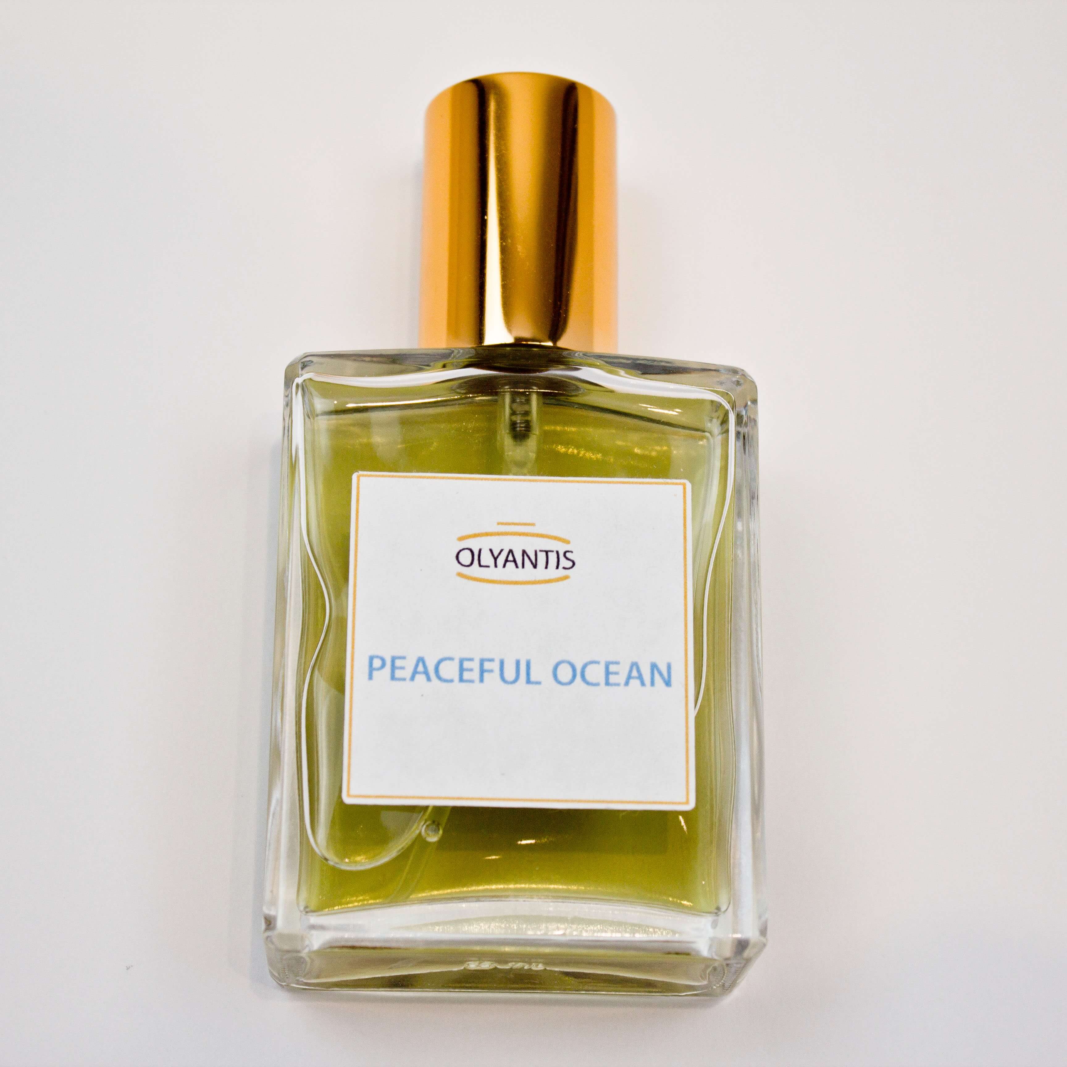 Olyantis 60 ml Peaceful Ocean eau de parfum bottle, lying flat on a white background. 