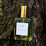 Olyantis 60 ml Peaceful Ocean eau de parfum bottle on a majestic tree background. 
