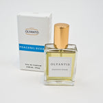 Olyantis's Peaceful Ocean 60 ml perfume beside its box. 