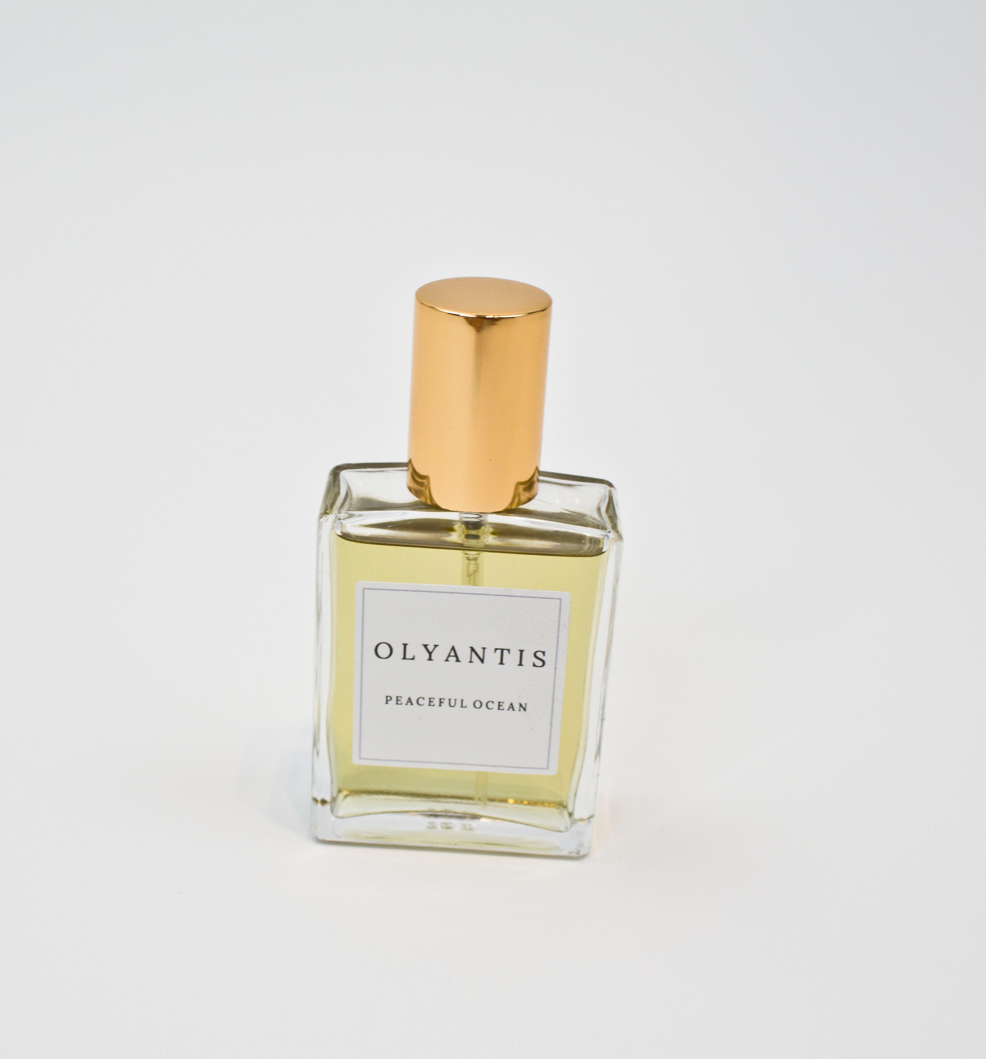 Olyantis's Peaceful Ocean 60 ml glass bottles, on white background. 
