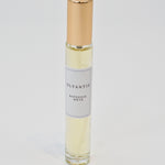 Olyantis's  Rapsodie D'Été 10 ml perfume glass bottle with gold cap on a white background.