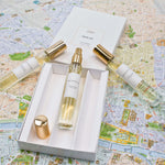 Olyantis's Travel Set of 3x 10 ml perfume glass bottles, on with golden cap off, in its opened box, on Montpellier’s ( France) city map. 