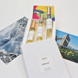 Olyantis's Travel Set of 3x 10 ml perfume glass bottles on 3 postcards from 3 different global destinations, including Lake Louise in Canada, London UK, and south of France. 